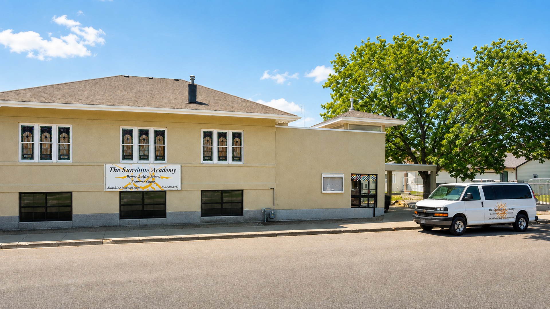 The Sunshine Academy 1st Street campus in downtown Laurel, with the school van parked out front